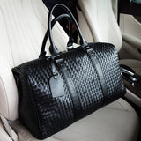 Spot  neutral travel bag, business portable big bag, solid color single shoulder hand-woven bag